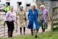 Duchess of Cornwall slips into comfy boots for farm visit
