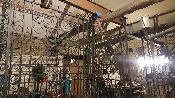 The gates being restored in the workshop
