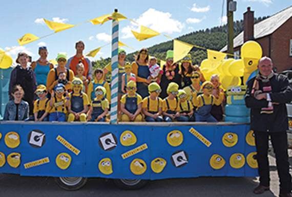 Parents and children dressed as the Minions on their float