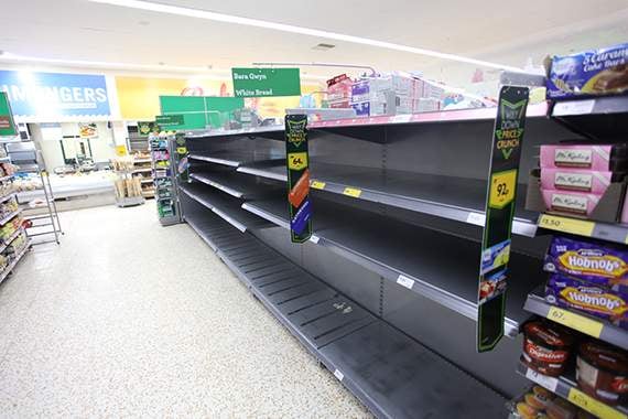 Shoppers strip shelves bare as snow stops deliveries