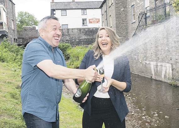 Richard and Faye celebrate with champagne