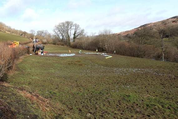 Staff from Natural Resources Wales take precautions against pollution reaching the River Wye