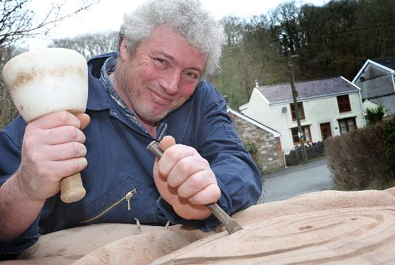 Olliver Annally works on the stone rose he has designed which will be part of a fountain in the memorial garden designed by Alan Titchmarsh at Hampshire Constabulary’s headquarters in south east England