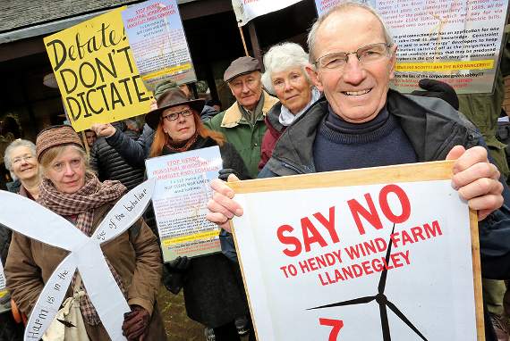Protesters gathered outside County Hall in Lladrindod Wells