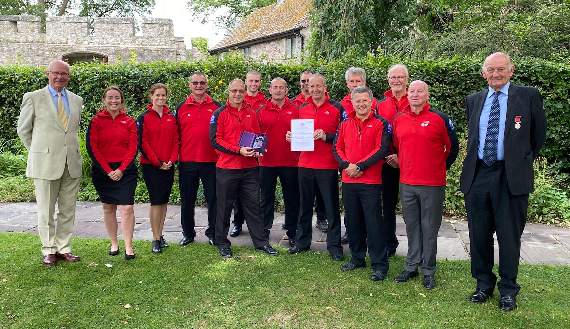 Representatives from Brecon Mountain Rescue team with Mark Kerr (left) and Mike Lewis (right).
