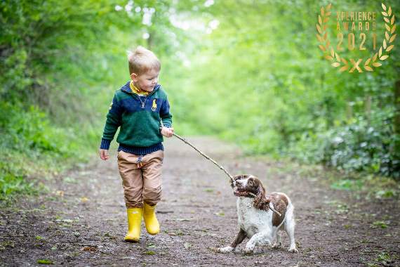 Chris's photo of a young boy with his dog Jessie in Hay