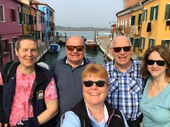 Nigel (back left) and partner Rob (back right) on holiday with friends in happier times.