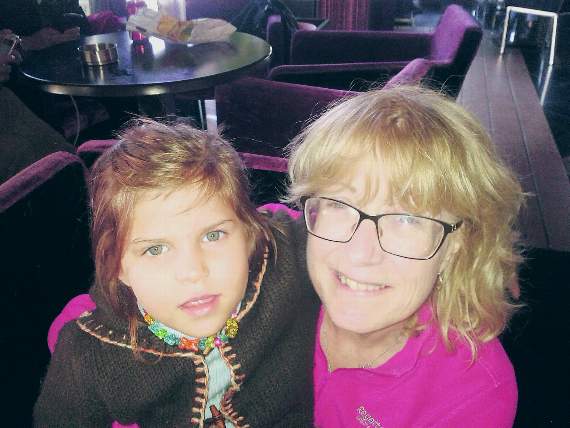 Caron with a Syrian refugee showing off her 'new' coat