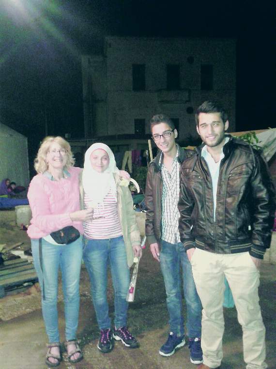 A group of refugees thanking Caron for her hard work on her last day