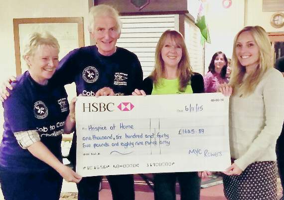 From left: Helen Aherne, Godfrey Owen and Tracey Miller present a cheque of £1,645.89 to Keerie McKie of Hospice at Home