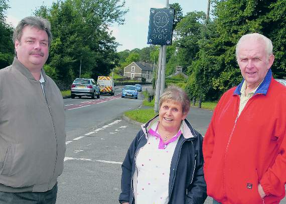 Steve Churchman (County Cllr.) Suzanne Millard (Neighbourhood Watch) and Huw Pritchard (Parish Council) pictured in Pentrefelin last year campaigning for tighter speed restrictions