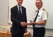 Commander George recognised for 'exemplary' 40 years as coastguard