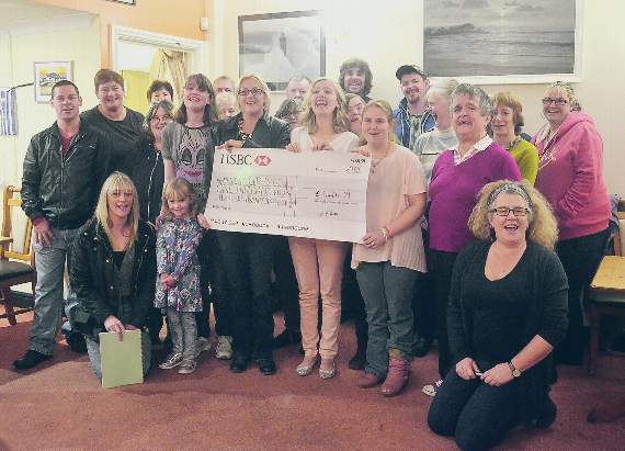 The Mencap cheque presentation at the Gateway Club at Aberaeron’s Prince of Wales: Front row (from left): Rhydian Evans, Elizabaeth Griffiths, Emma Elder, Lily Evans , Bethan Kench, Angie Gee, Ffion Lloyd, Sophie Lewis, Megan Issac and Claire Ward. Back row: Rasus Team and Mencap Ceredigion members