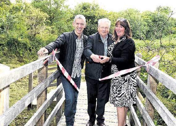 Robert David of Felin Cefn Llanfair, Lord Dafydd Elis Thomas (AM) and Cllr Angela Rusell officially opening the new footbridge