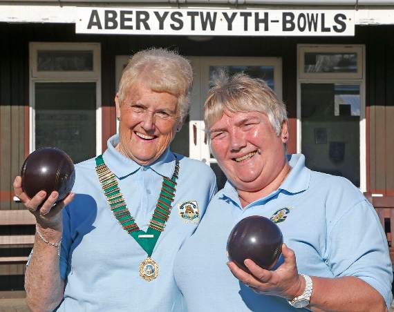 Photo Code 16DPJ07APR121 Photo Arwyn Parry Jones 07April16 Ref Antony; Aberystwyth and Plascrug Bowling Club. - The club is important to it's members in many ways also to the town. It is important to members in that it provides a social hub, competitive sport and social sport. Players meet members of different clubs enabling them to make a wider circle of friends and contacts, Bowls is sport that can be played young and old a like due to this grand parents can play with their grand children and their children. A true family sport. It is also a sport that enables disabled and able bodied to play alongside each other. The club has a visually impaired Welsh International,Peter Willams, who regulary plays along side able bodied membersClub members Marian Wintle (club president) and Min Evans (secretary Aberystwyth Bowling Club and President of CBMC (Cymdeithas Bowlio Merched Ceredigion))