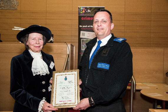 Darren Walters of Barmouth receiving his award