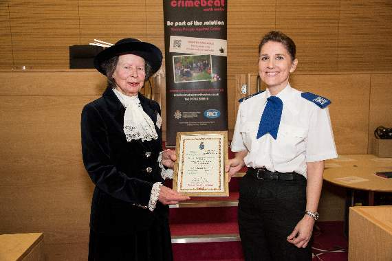 Elizabeth Jones of Pwllheli receiving her award from