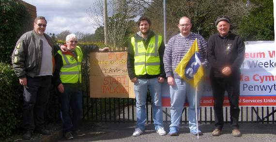 Striking workers are angry at proposed wage cuts. Pictured are some of the workers out on strike