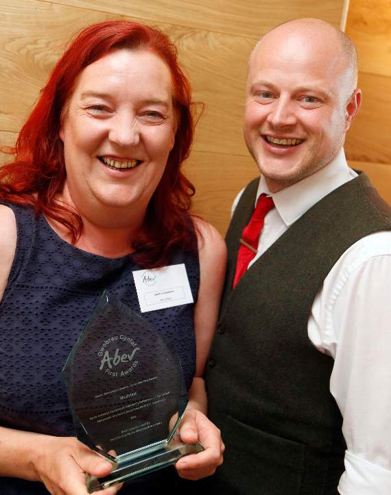 The Aberystwyth Arts Award for Recognising the Arts of Aberystwyth was sponsored by Aberystwyth Arts centre. Receiving her award from Gareth Lloyd Roberts of the Arts Centre manager is Sandra Bendelow of Music Fest