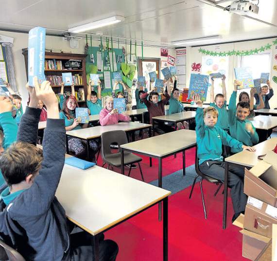 Pupils from Ysgol Gynradd Dolgellau showing off their books