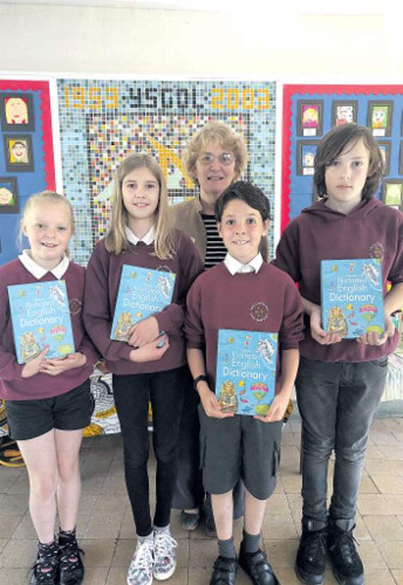 Four pupils from Ysgol Dinas Mawddwy with their gifts