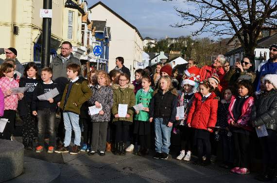 Ysgol Cymerau schoolchildren singing carols for the Pwllheli public