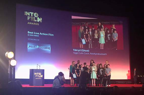 The pupils go on stage to collect their award
