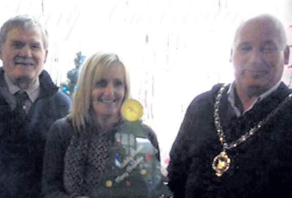 Wendy from Wendy's News; chair of Tywyn Town Council Alun Wyn Evans and Cllr Ron McCoo who helped to organise the competition
