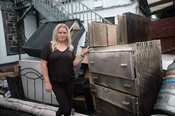 Suzanne Fox with some of the furniture damaged in the blaze last week