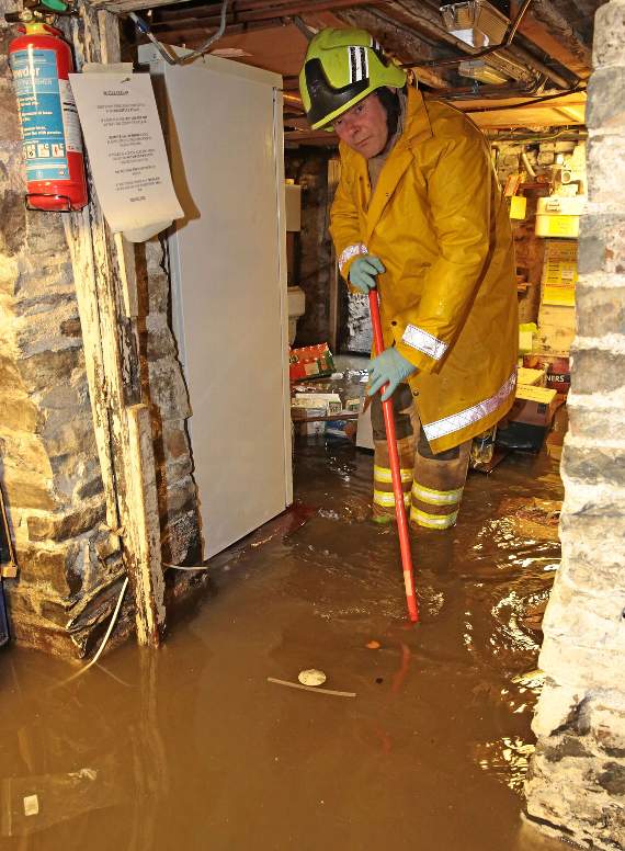 Nigel Bowden, crew manager at Aberystwyth Fire Station, is seen in the cellar of the Cambrian Hotel
