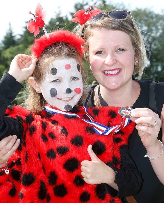 Seven-year-old Phoebe Alban, who is seen her with mum Michelle Evans, was dressed as a ladybird