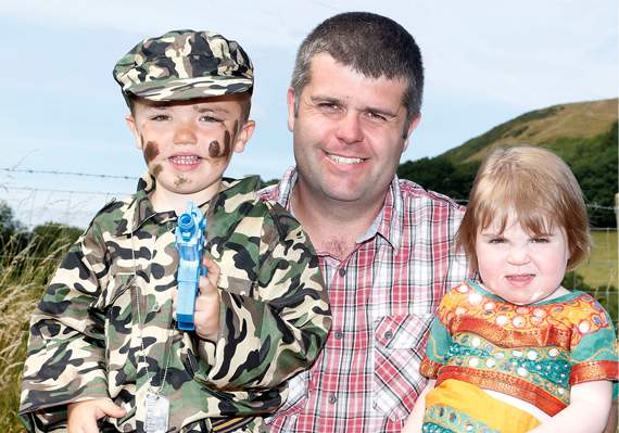 Rhun and Mari Lloyd are pictured with their dad, Alun