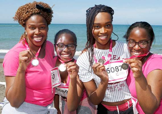 Students Nikky Adeh, Victoria Opaleye, Victoria Eniola and Pelumi Opaleye proudly display their medals