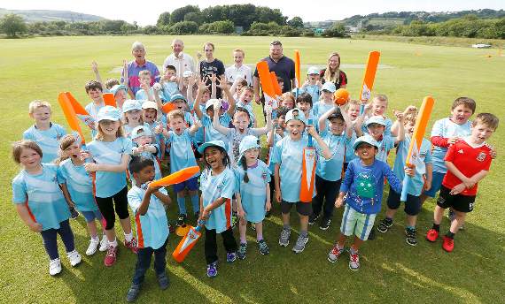 Anthony Evans, Robin Valey, Tomos Williams, Rowan Dunbabin, Andi Price and Siwan Burrell with members of All Stars Cricket Club