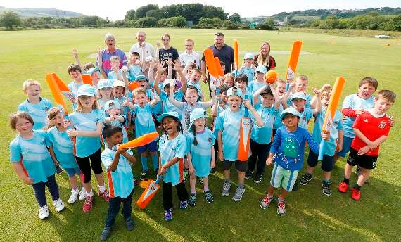 Anthony Evans, Robin Valey, Tomos Williams, Rowan Dunbabin, Andi Price and Siwan Burrell with members of All Stars Cricket Club