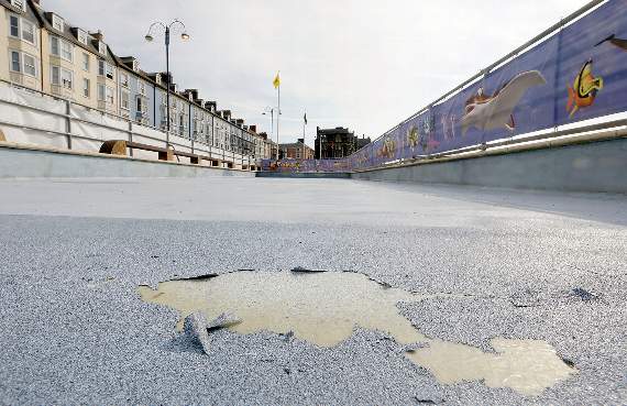 Cllr Ceredig Davies said there are "some underlying problems" with the base of the pool