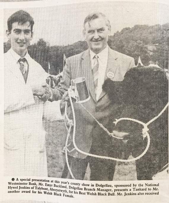 a special presentation at the show, in 1987, Emyr Buckland, manager of the National Westminster Bank in Dolgellau, presents a tankard to Hywel Jenkns of Talybont, Aberystwyth, for his best Welsh Black Bull.