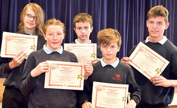 These pupils achieved 100 per cent attendance. Back row from left: Ifan Howells-Baines, Llyr Jones and Gethin Evans, the three from Year 10. Front row: Elliw Jones, Year 8 and Charlie Roberts, Year 7. Absent from the photo because of rugby training was Alun Kimberly from Year 10