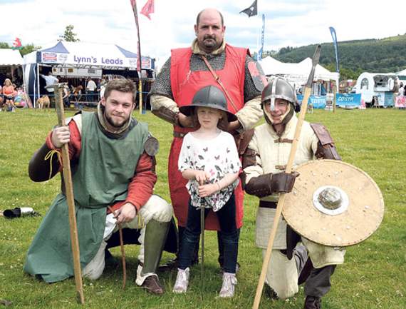 Prince’s Family are a group of people that come together do re-enactments. Pictured are three of the members looking very fearsome with eight-year-old Elan Williams from Cynwyd who enjoyed having her photo taken with them