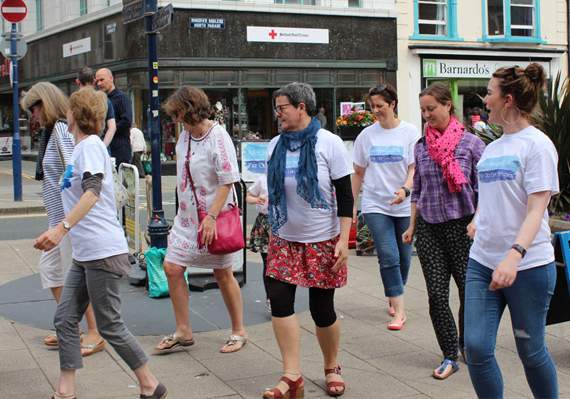 People line-dancing in Owain Glyndwr Square