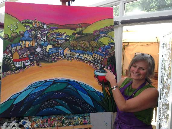 Helen with her painting of Llangrannog
