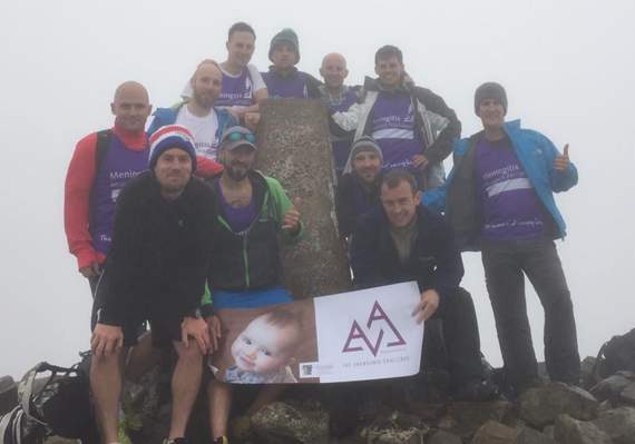 The team pause for a breather at the summit of Cader Idris