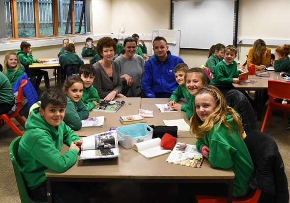 Cllr Gareth Williams is pictured with staff and pupils at the temporary classroom in Congl Meinciau