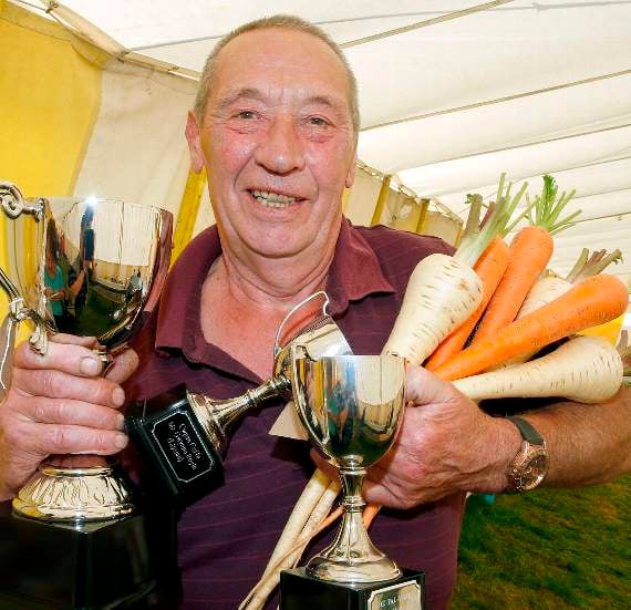 Tudor Gethin of Bow Street won Best Tray of Vegetables and Highest Number of Points in the Vegetable Section. He also won a Memorial Cup for the Highest Points in the Special Section of Vegetables with his carrots and parsnips. 17DPJ31AUG127