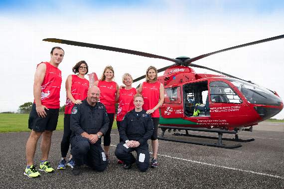 Hugh James Cardiff Half Marathon team members Tomos Lewis, Marta Gawryszczak, Rebecca Mather, Mari Rosser and Cari Sowden-Taylor are pictured with members of the Wales Air Ambulance team