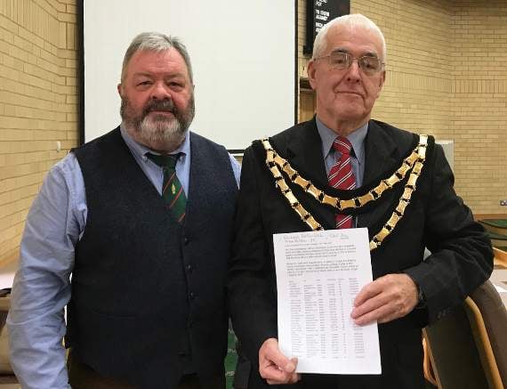 Cllr Paul James handing in a petition to Ceredigion County Council chairman Cllr Lynford Thomas calling for a feasibility study into traffic-calming measures in Llanbadarn