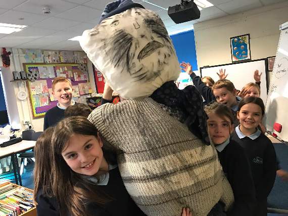 Ysgol Llanystumdwy pupils with the guy they created for Friday’s Bonfire on the Beach