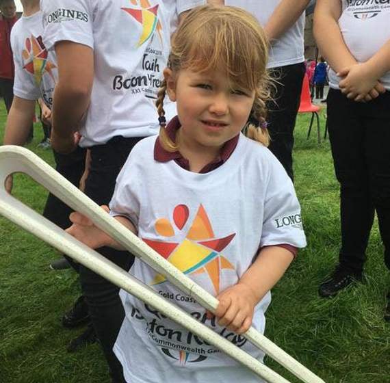 The youngest baton bearer, four-year-old Ffion Davies from Llanidloes Primary School