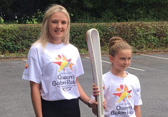 Lauren Williams and Enya Jones with the baton at Llanidloes High School