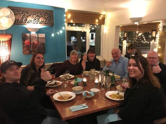 Diners at the Coconut Kitchen enjoying one last curry